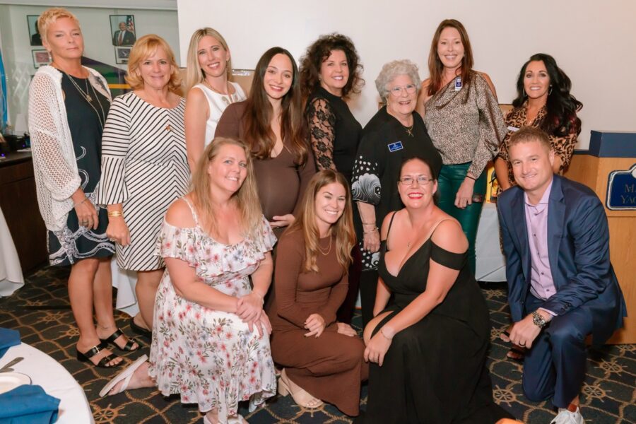 a group of women posing for a picture together