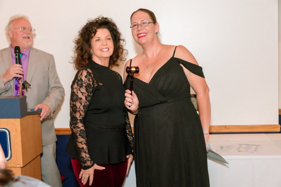 a couple of women standing next to each other