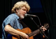 MAC McANALLY & NICK NORMAN SELL OUT KEY WEST THEATER a man with a beard playing a guitar