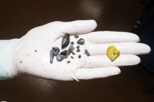 a person's hand with a yellow smiley face painted on it