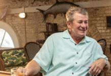 a man sitting at a table in a restaurant