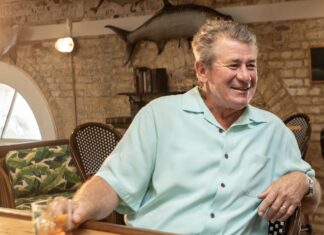 a man sitting at a table in a restaurant