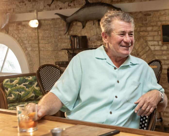 a man sitting at a table in a restaurant