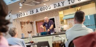 a group of people sitting at a table with wine glasses