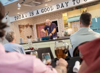a group of people sitting at a table with wine glasses