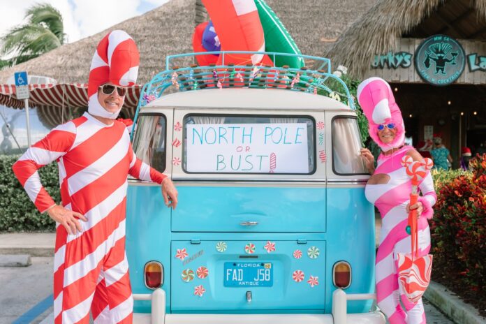 two people in costumes standing in front of a van
