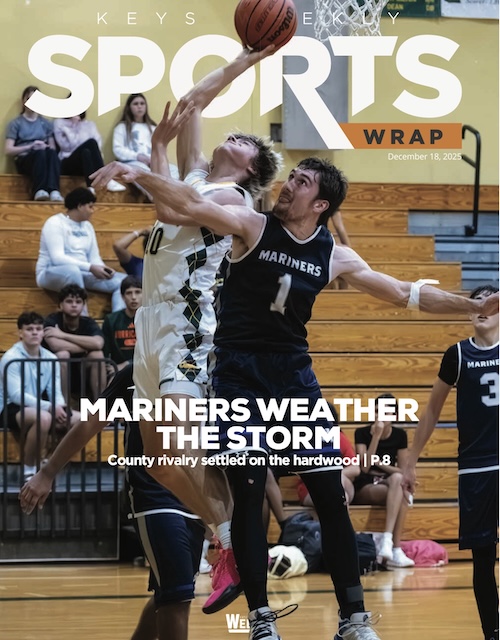 a magazine cover with a basketball player trying to block a shot