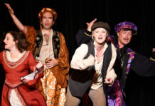 RED BARN THEATRE’S ‘SCROOGE MACBETH’ CAST NAILS IT, SAYS PLAYWRIGHT a group of people that are standing on a stage