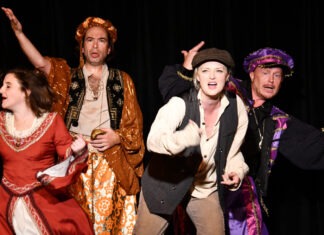 a group of people that are standing on a stage