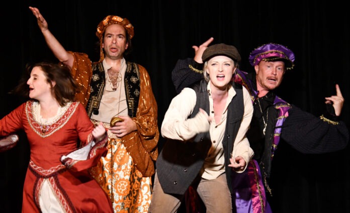 a group of people that are standing on a stage