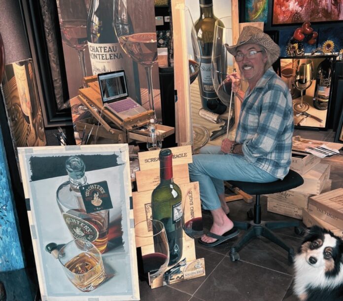 Thomas Arvid Large a man sitting in a chair next to a dog