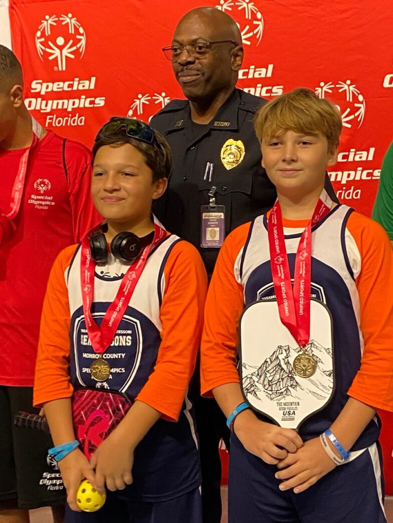 a group of young men standing next to each other