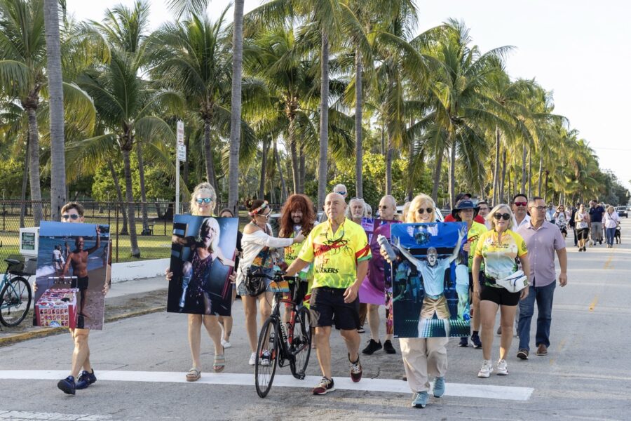 a group of people walking down a street