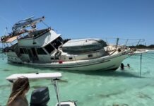 a woman is sitting on a boat in the water