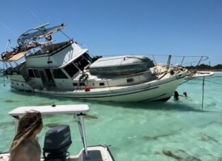 SO MUCH HAPPENED, WE MADE A LIST: RELIVING 2025 THROUGH MARATHON HEADLINES a woman is sitting on a boat in the water