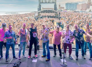 a group of people standing on top of a stage