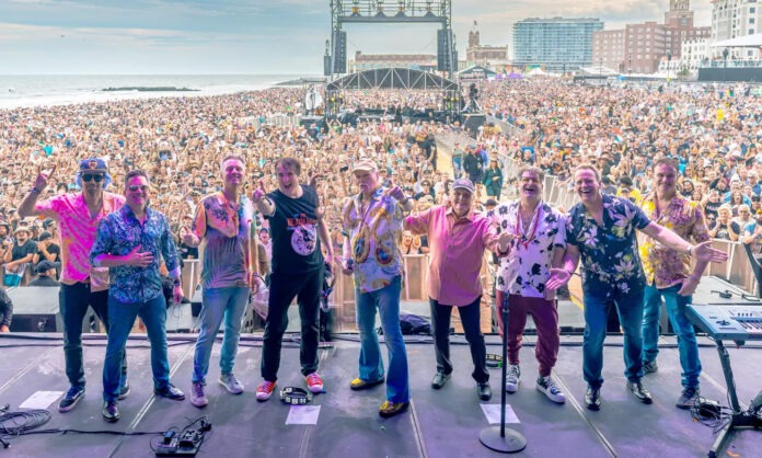 a group of people standing on top of a stage
