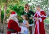 THIS WEEKEND: ENJOY ISLAND LIGHTS & A FESTIVE NIGHT AT THE PIGEON KEY HOLIDAY SPECTACULAR a group of people dressed up as santa claus