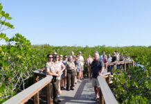 a group of people standing on a bridge