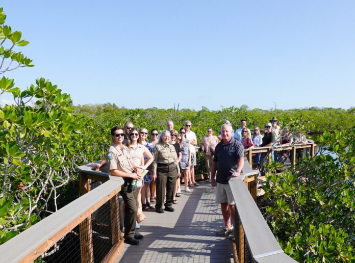 a group of people standing on a bridge