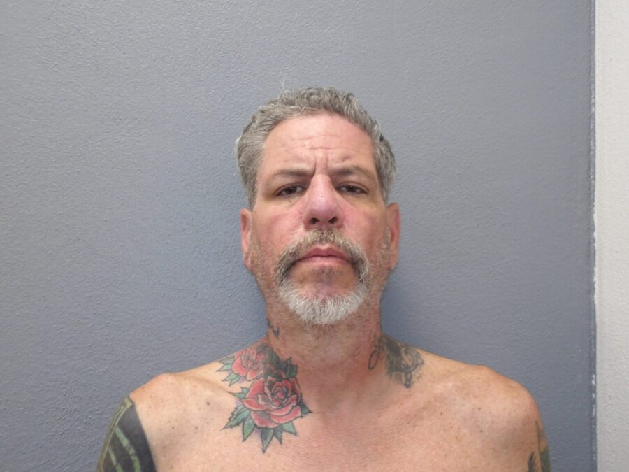 a man with a tattoo on his chest