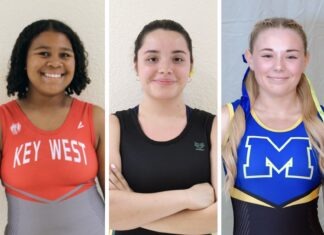 LADY LIFTERS MAKE GAINS BEFORE THE HOLIDAY BREAK a group of three women standing next to each other
