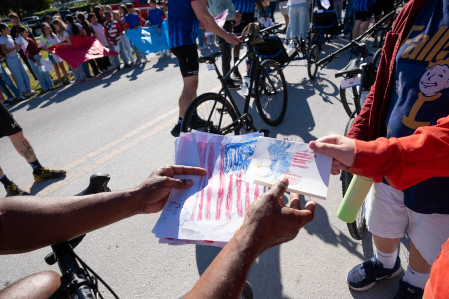 a group of bicyclists passing by on a street