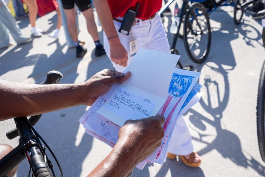 a group of people standing next to each other on a street