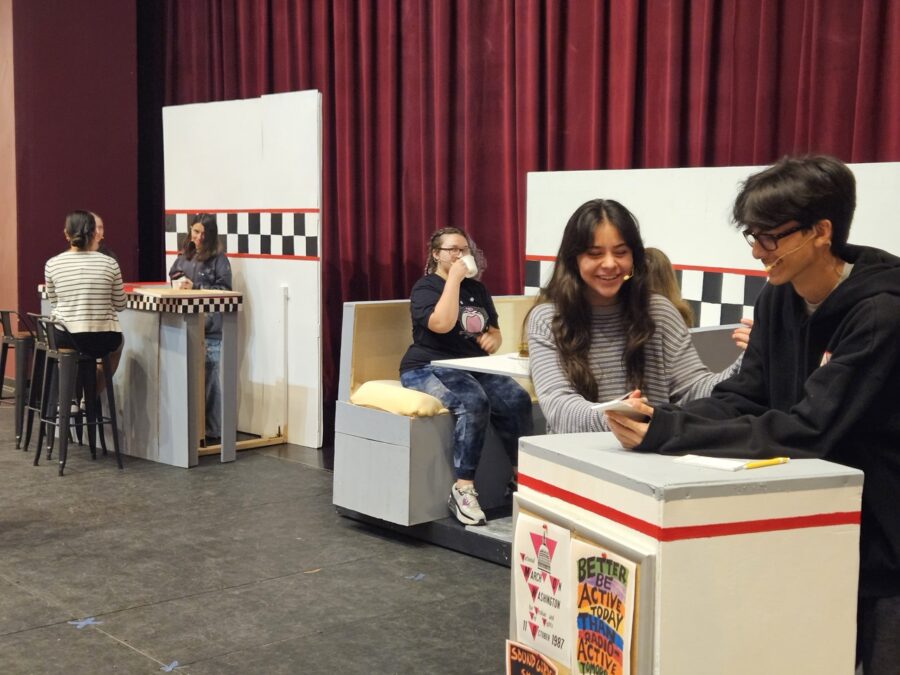 a group of people sitting around a table in a room