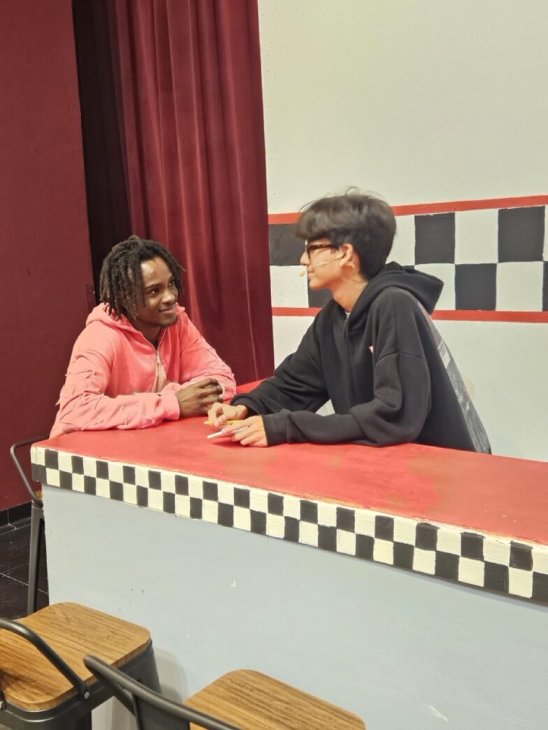 a couple of people sitting at a table