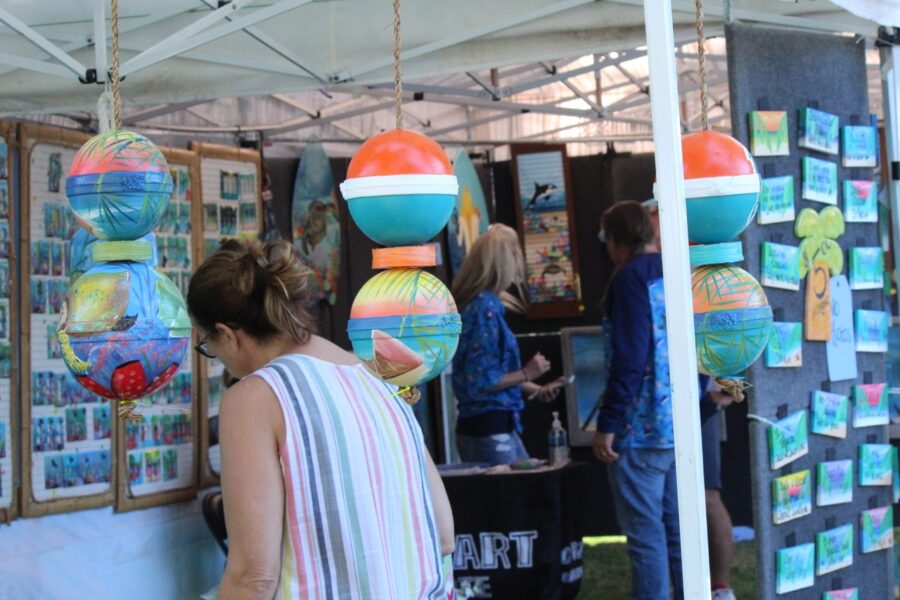 a group of people standing under a tent