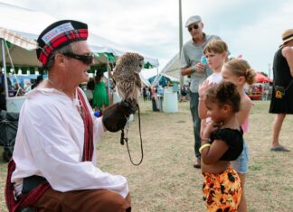 IN PICTURES: 2026 FLORIDA KEYS CELTIC FESTIVAL EARNS RECORD-BREAKING WEEKEND a man holding an owl in his right hand