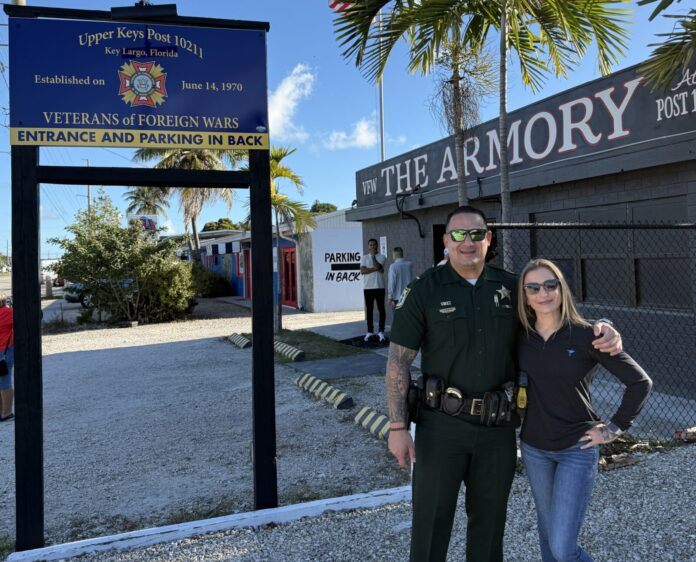 a police officer standing next to a woman