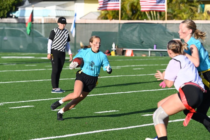 a group of girls playing a game of football