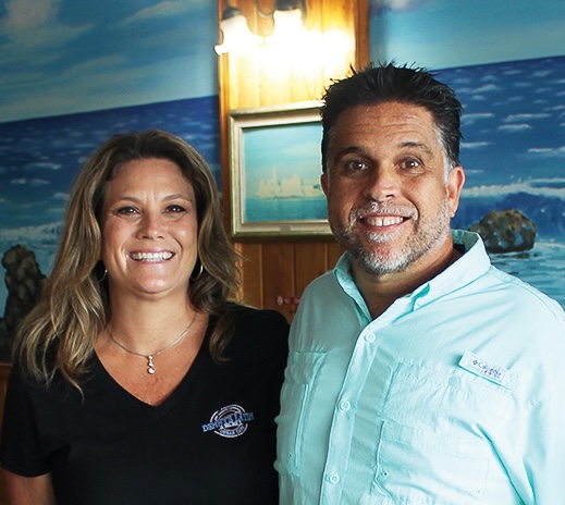 a man and a woman standing next to each other
