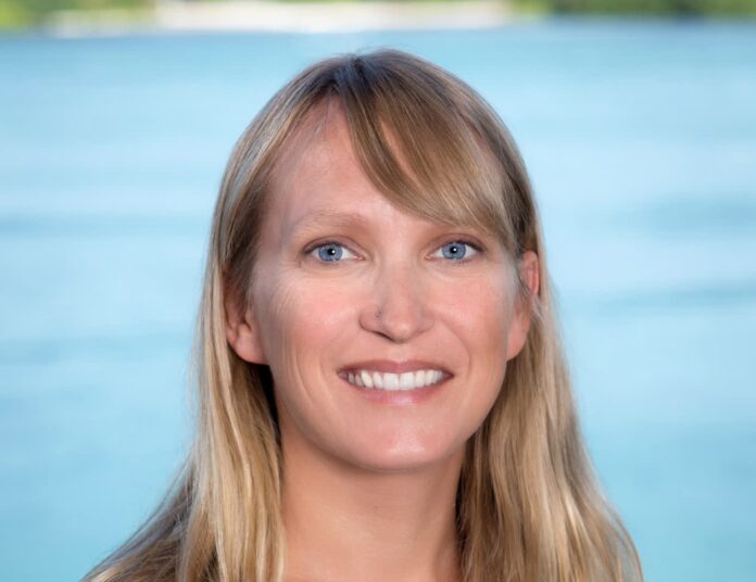 Erinn Muller Headshot a woman with long blonde hair and blue eyes