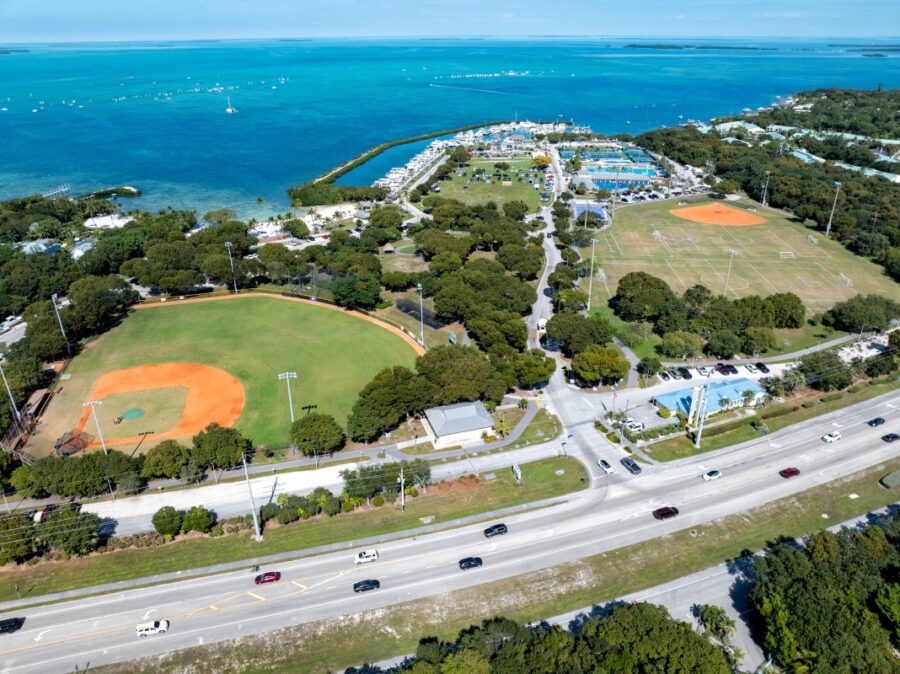 an aerial view of a baseball field near the ocean