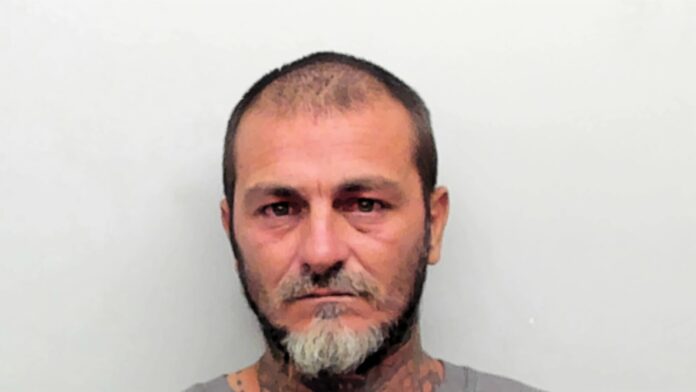 Guajardo a man with a beard and tattoos on his face