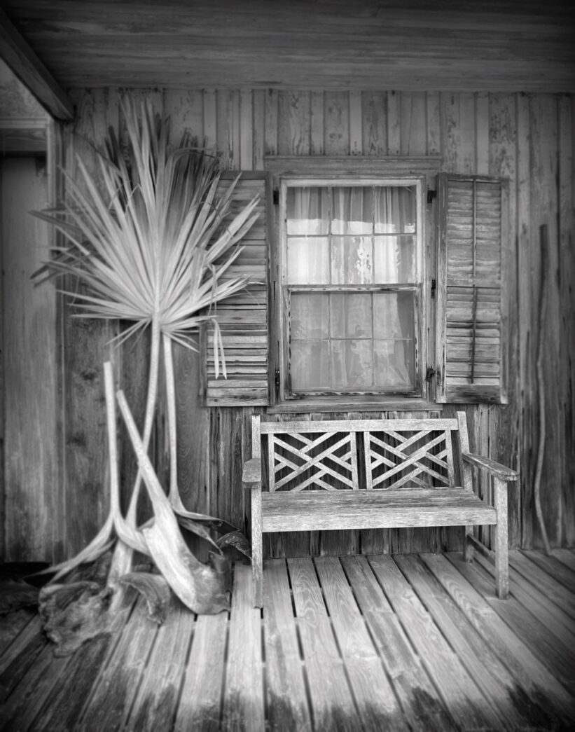 a wooden bench sitting on top of a wooden floor
