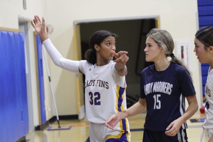 IMG_1274 a group of young women playing a game of basketball