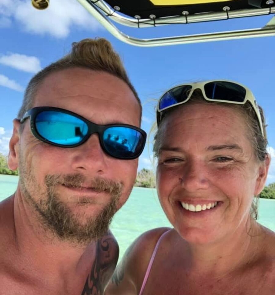 a man and a woman on a boat in the water