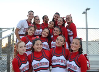 KEY WEST COMPETITIVE CHEER CLINCHES REGIONAL CHAMPIONSHIP a group of cheerleaders posing for a picture