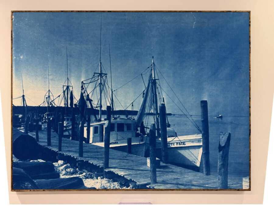 a painting of a boat docked at a pier