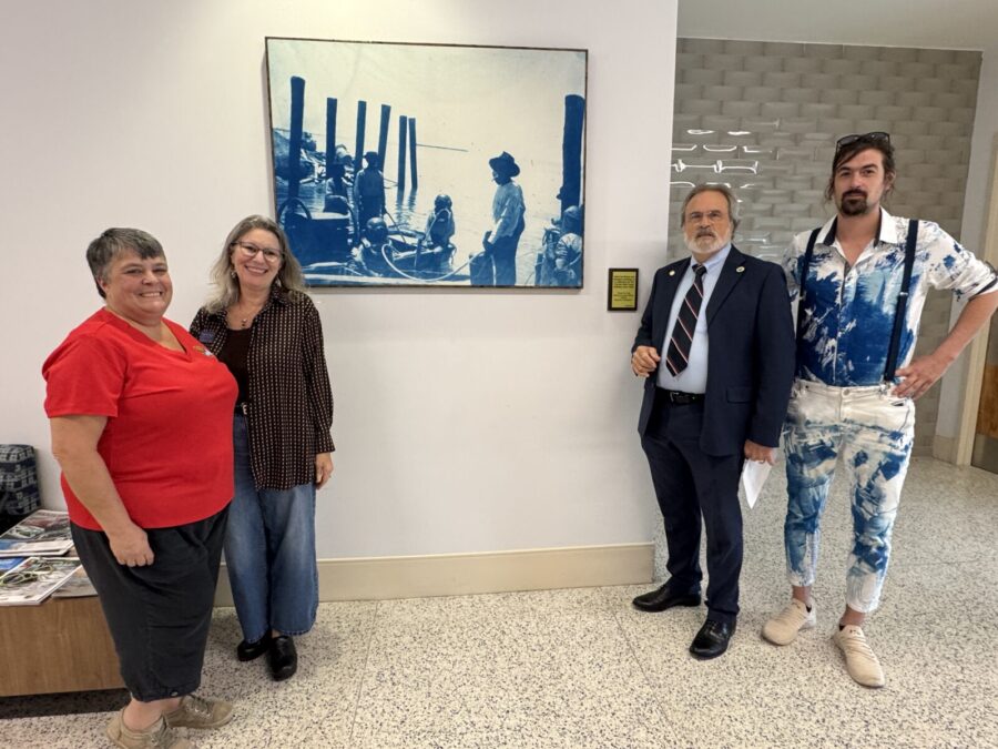 a group of people standing in an office