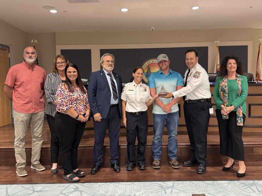 a group of people standing next to each other on a stage