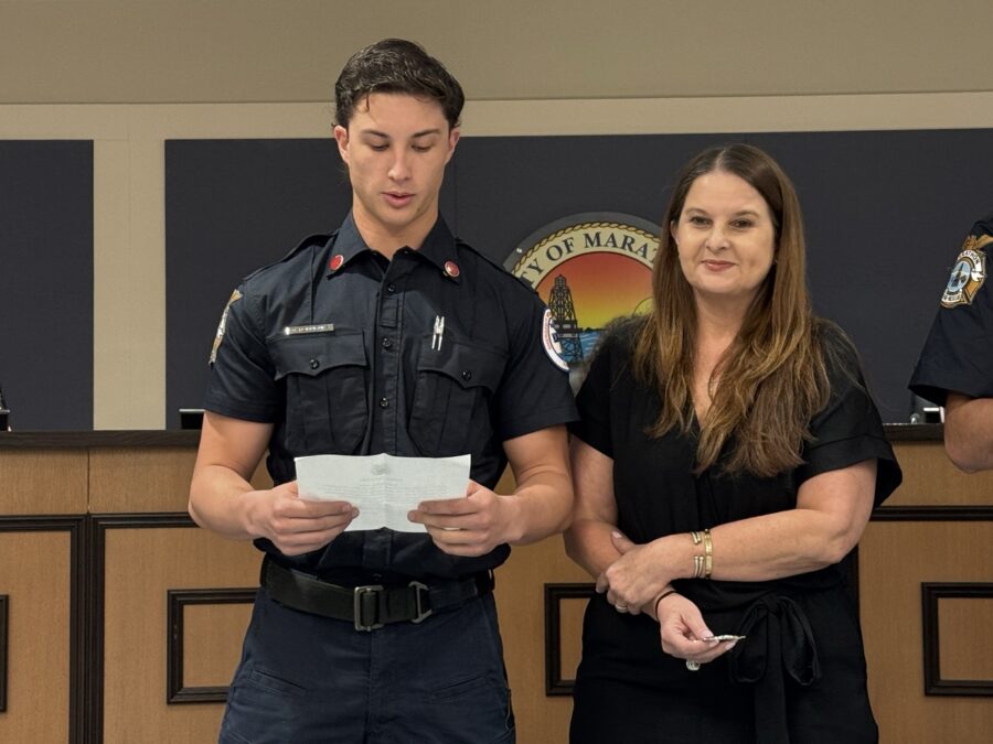 a man and a woman standing in front of a podium