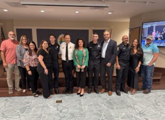 GO UP, OR STAY THE SAME? MARATHON COUNCIL DEBATES VACATION RENTAL FEES a group of people standing in front of a tv