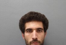 BOSTON MAN FLIPS ‘THE BIRD’ WHILE LEADING POLICE ON CHASE IN U-HAUL THROUGH THE UPPER KEYS a man with a beard is looking at the camera