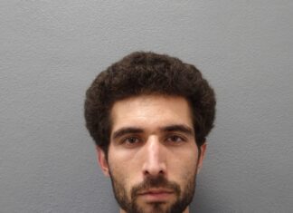 BOSTON MAN FLIPS ‘THE BIRD’ WHILE LEADING POLICE ON CHASE IN U-HAUL THROUGH THE UPPER KEYS a man with a beard is looking at the camera