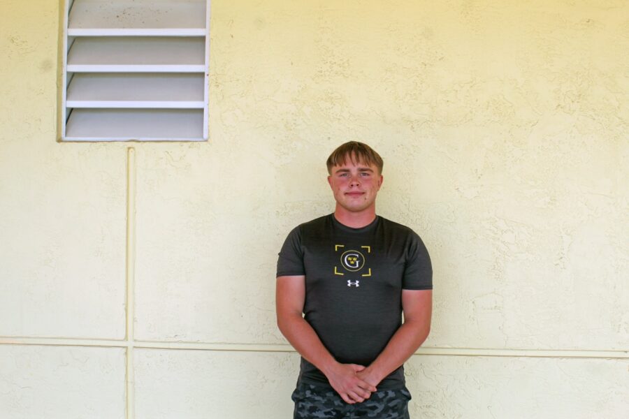 a man standing in front of a wall